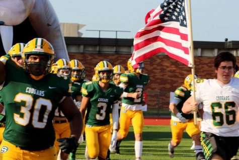 Football team runs onto field 