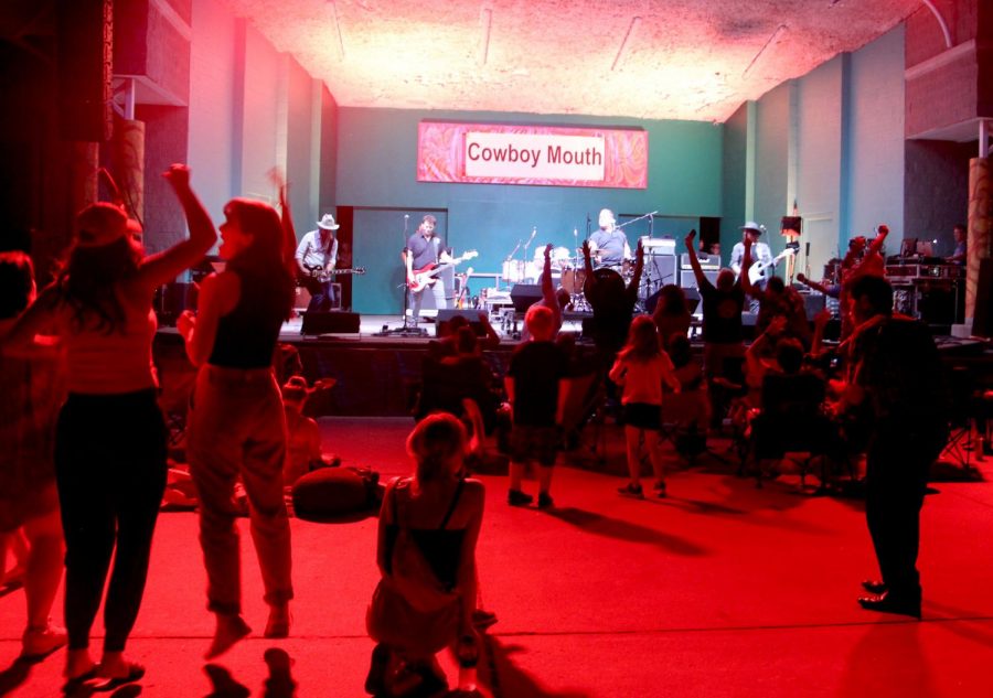 Cowboy+Mouth+plays+for+audience+under+red+lights+at+the+main+stage.+