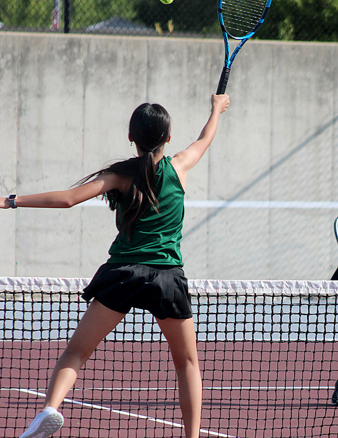 Julie Lai freshman goes for a net shot at her doubles match on Sept. 1. 