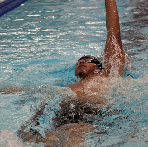 Junior Mason Gardener swims the backstroke in the 200 IM event during the Jan. 5 swim meet.