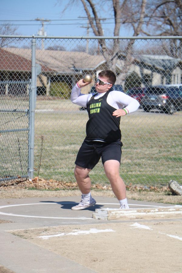 Junior Derrick Vargas throws shot put at the first track and field meet of the year. 
