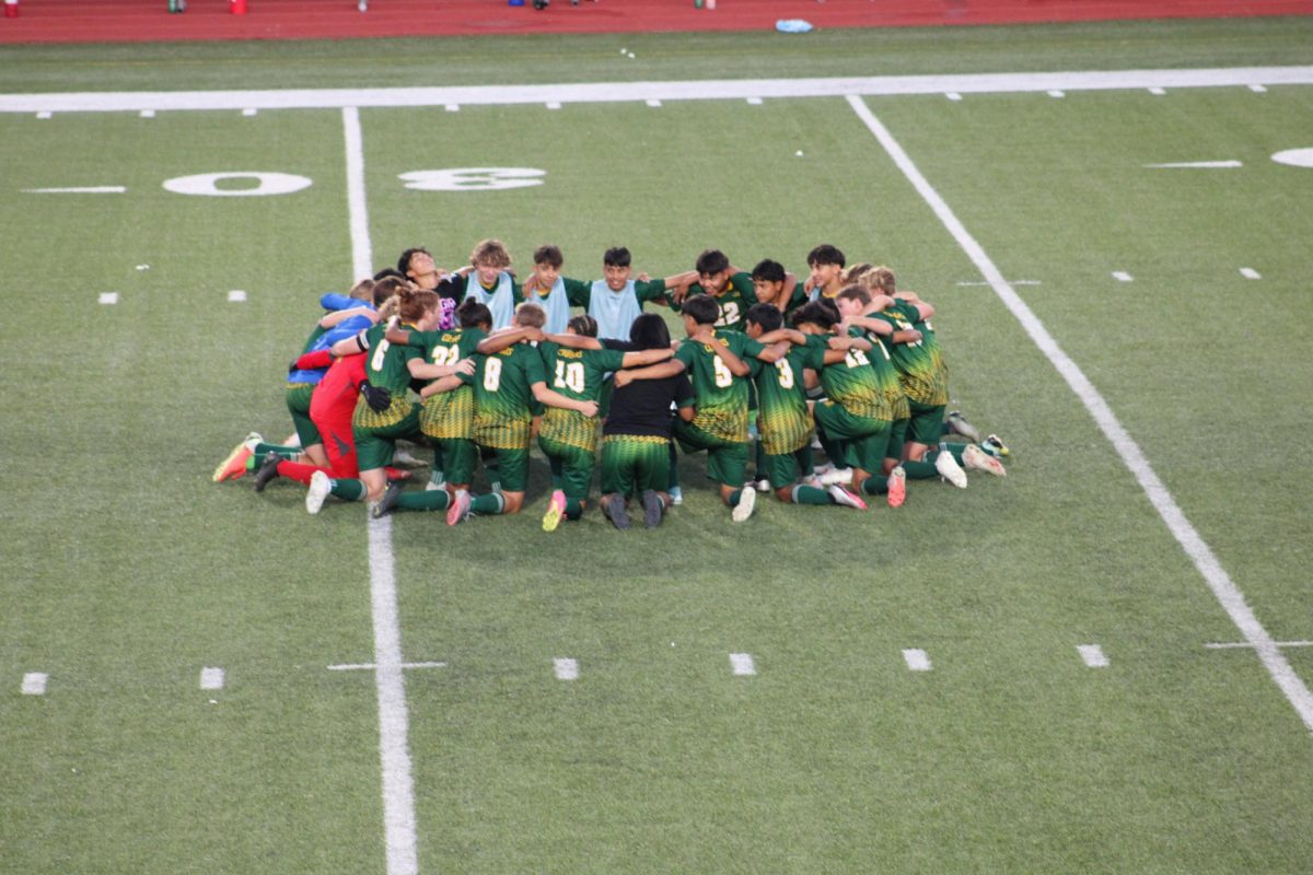 South High varsity soccer team huddles before the regionals game against Derby.