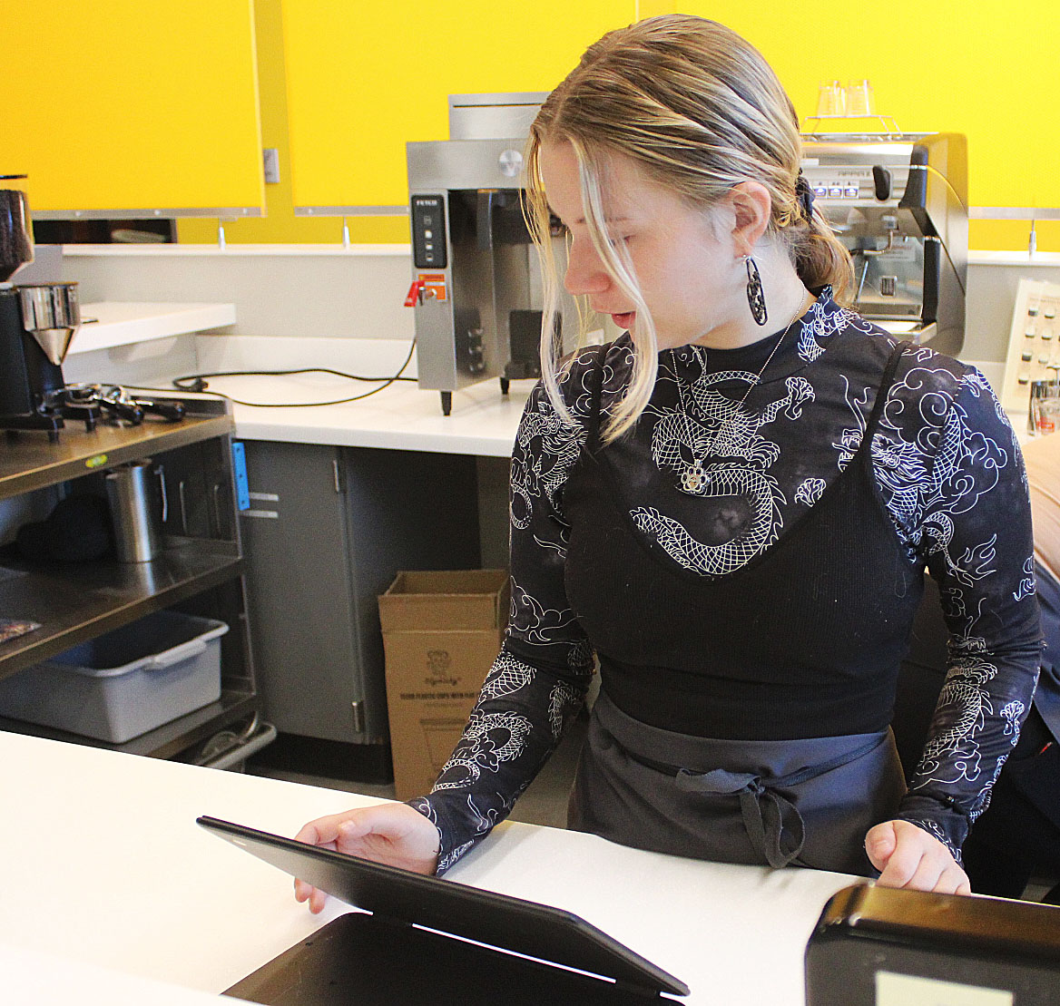 Culinary intern Isabella Freidhof ('25) takes a a students order.