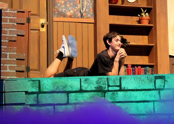 Allen Johnson ('26) rehearses for his role as Seymour in "Little Shop of Horrors". "It has been one of the best theatrical experiences of my life. Playing Seymour has been so fun, especially the puppets," Johnson said. 