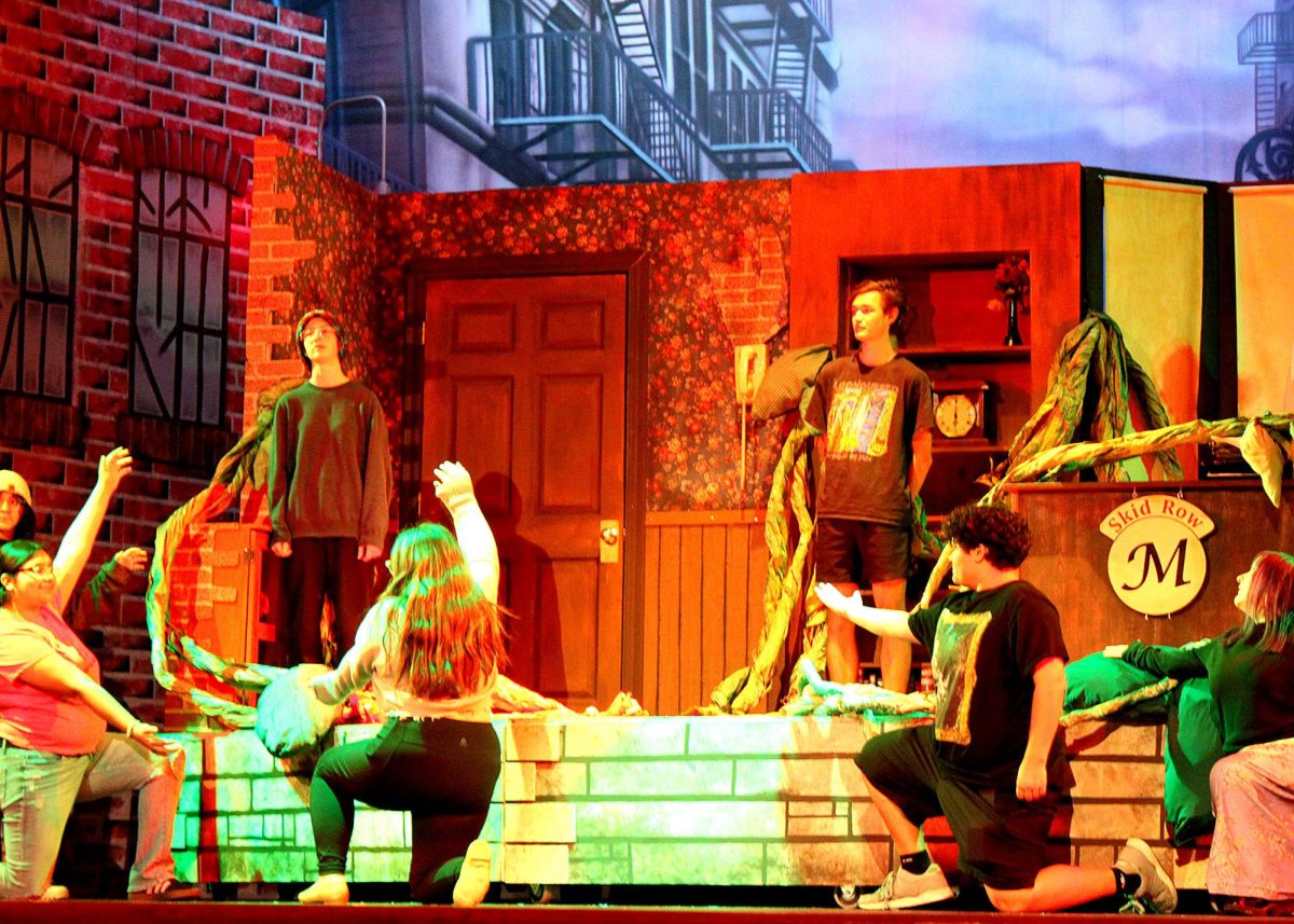 The cast of "Little Shop Of Horrors" practices the end of the show. 