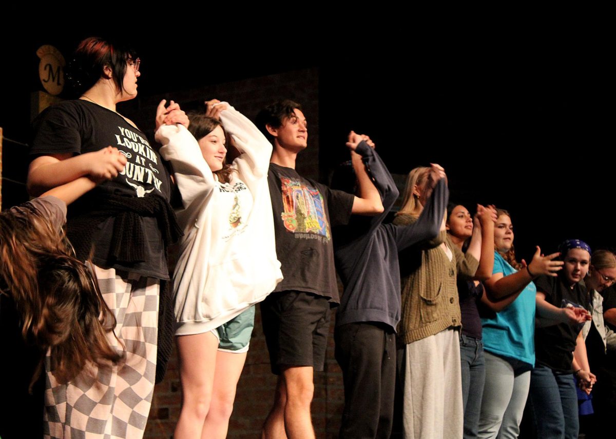 The cast of "Little Shop of Horrors" bow after a rehearsal. 