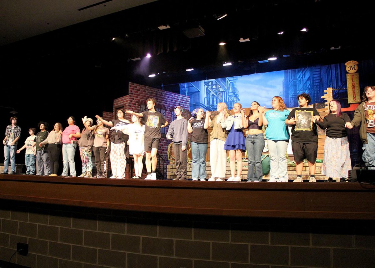 The cast of "Little Shop of Horrors" rehearses curtain call. 