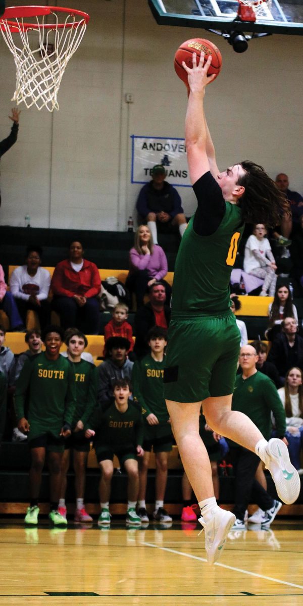 Jace Humphrey ('25) jumps and makes a two pointer.