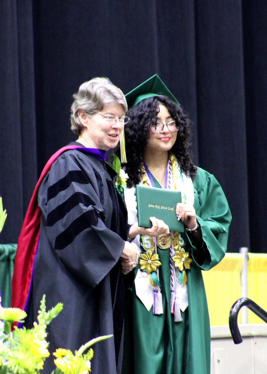 Destiny Gonzalez-Keophaymany ('25) accepts her diploma. 
