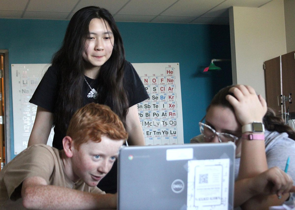Corbin Ebert ('28), Amy Tso ('28) and Emily Brenneman ('28) work together in the STUCO ELO