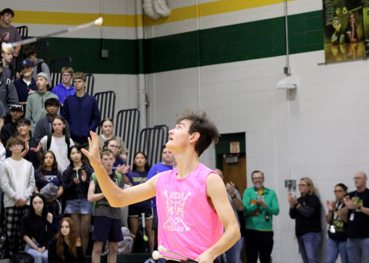 Allen Johnson ('26) twirls during the fight song. 