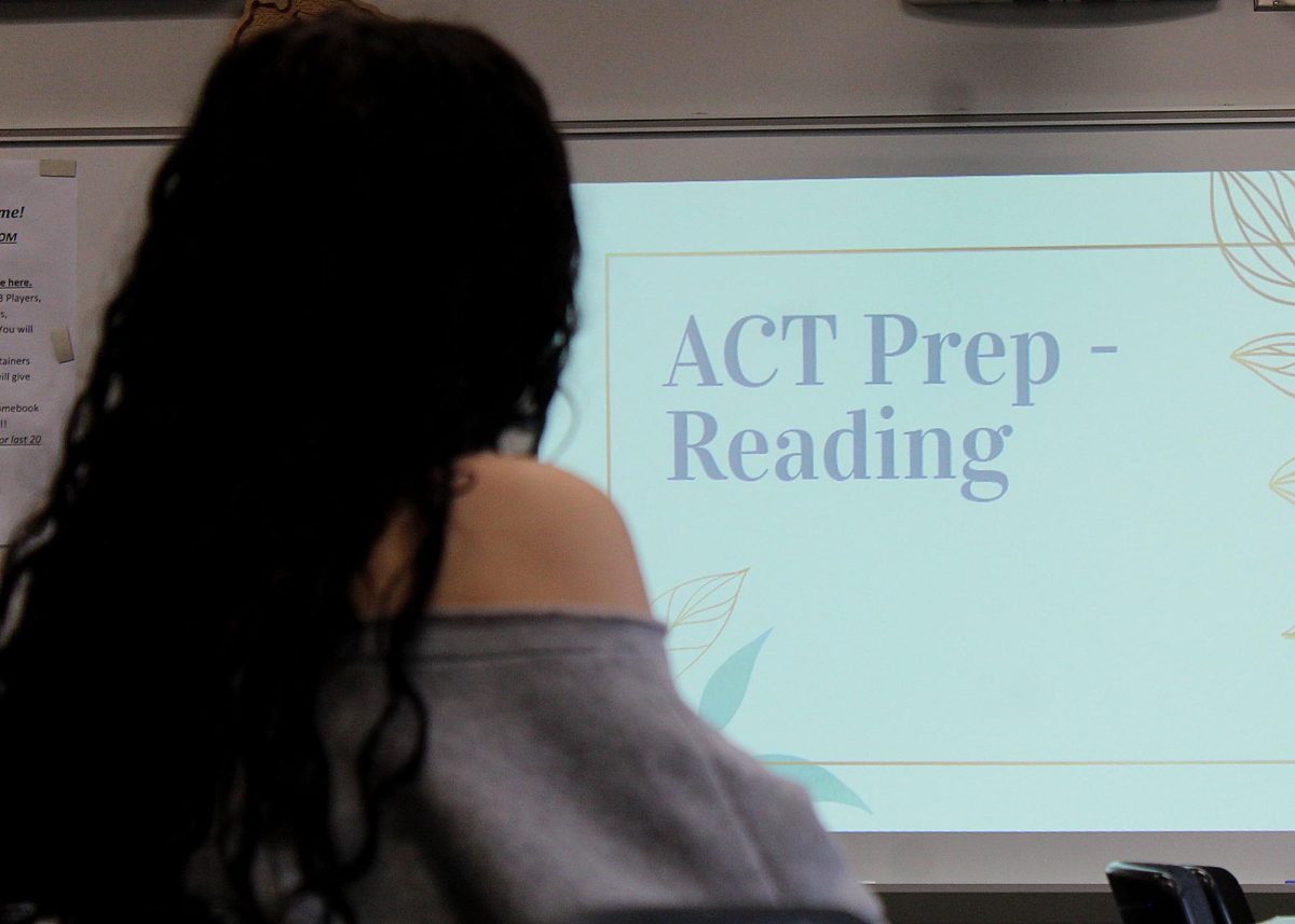 Gabriella Castro ('27) listens to Gifted Coordinator Niki Chamberlain give tips to prepare for the reading section of the ACT. 