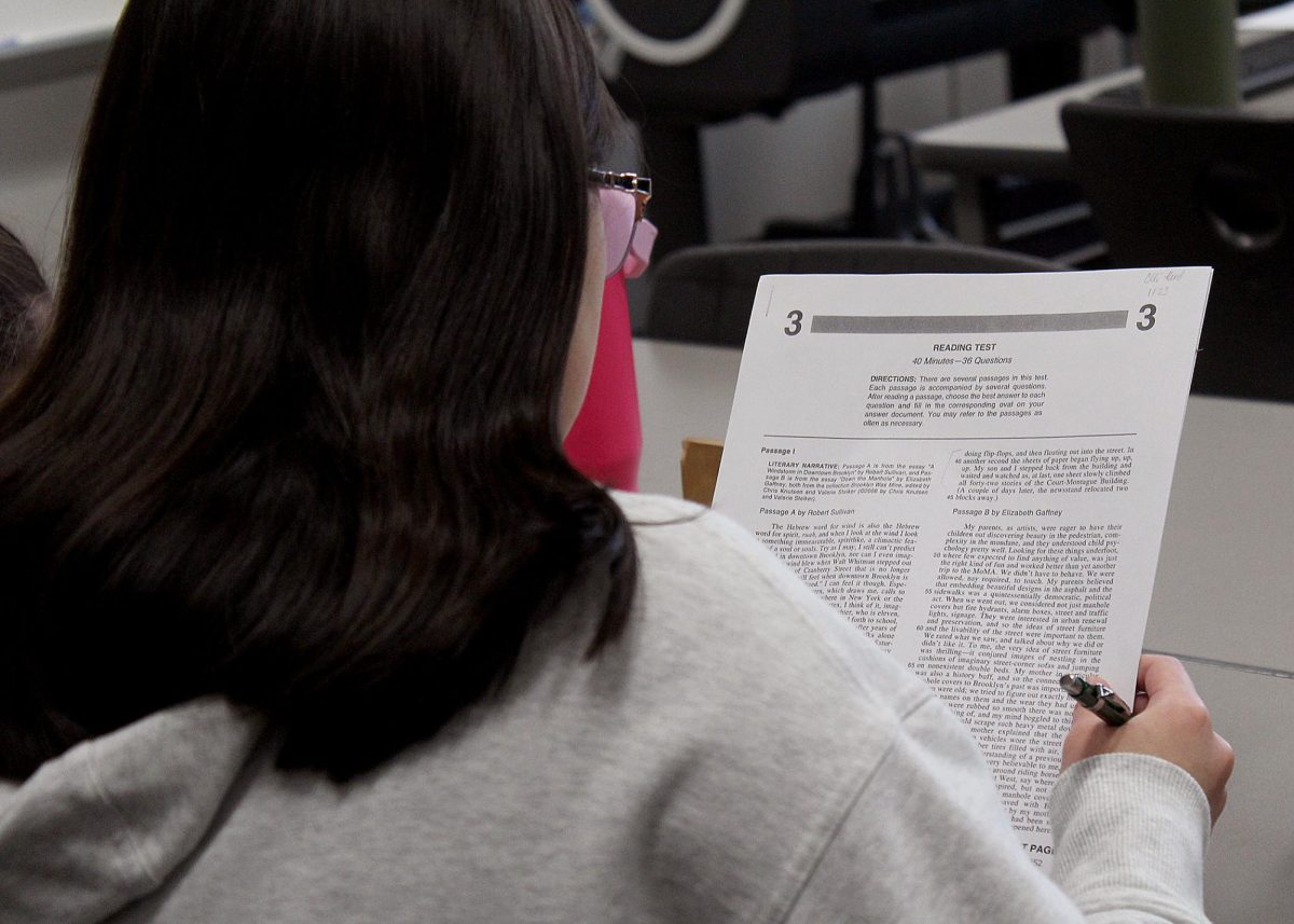 Elliana Reed ('28) reads over a passage for a practice ACT reading test before answering the questions. 
